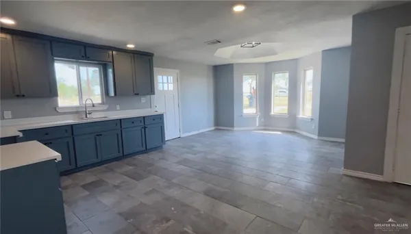 a bathroom with a sink and a large mirror