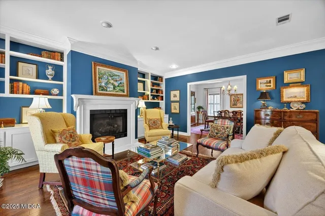 a kitchen with stainless steel appliances kitchen island granite countertop a sink and cabinets