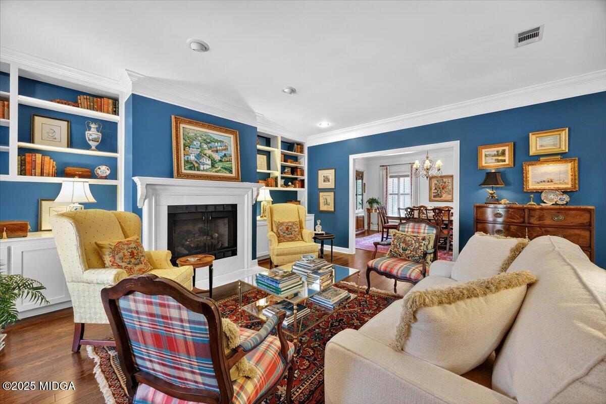 133 Covington Place Macon, GA 31210 - Photo 12 of 36 a living room with furniture a fireplace and a large window