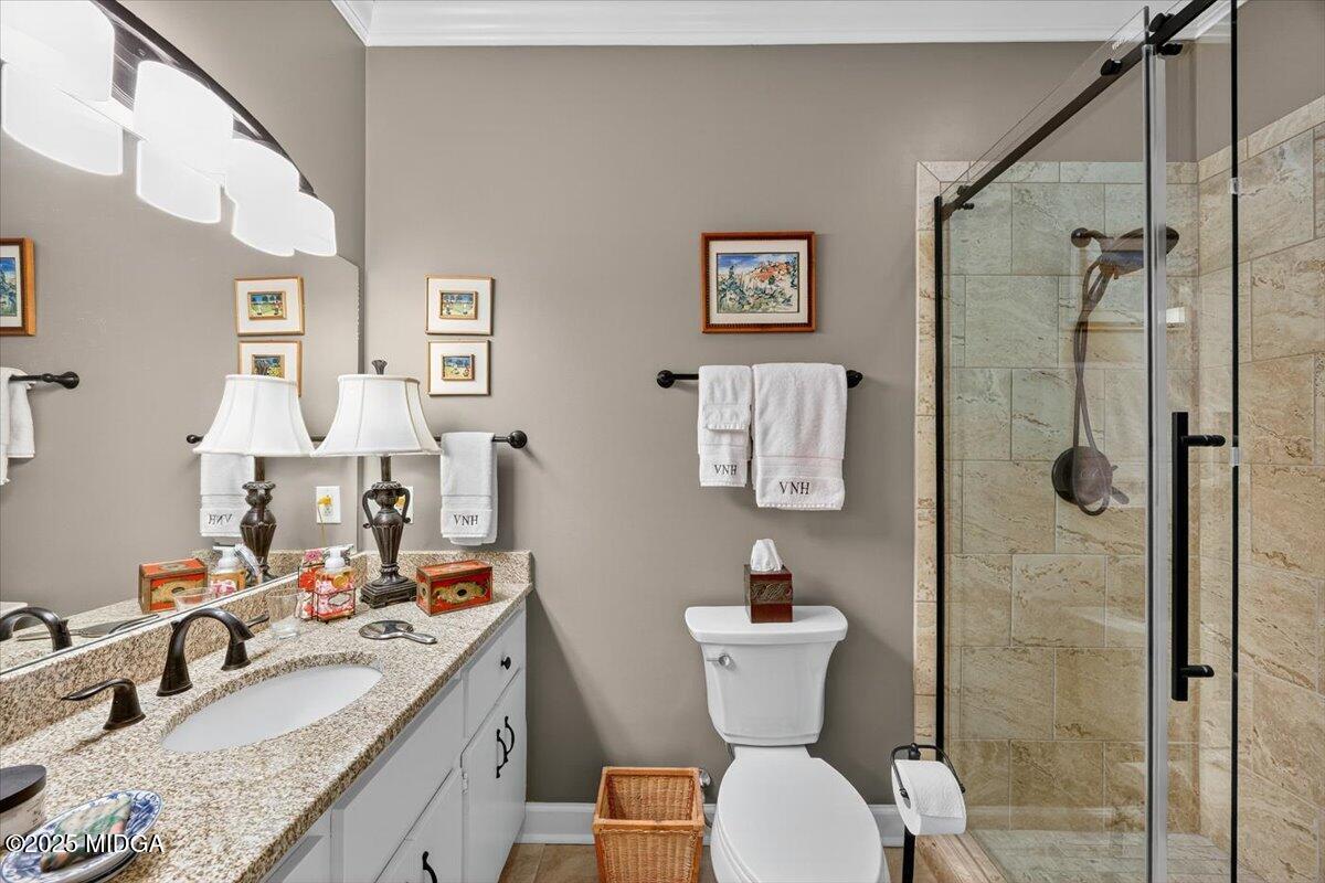 133 Covington Place Macon, GA 31210 - Photo 26 of 36 a bathroom with a granite countertop sink toilet and shower