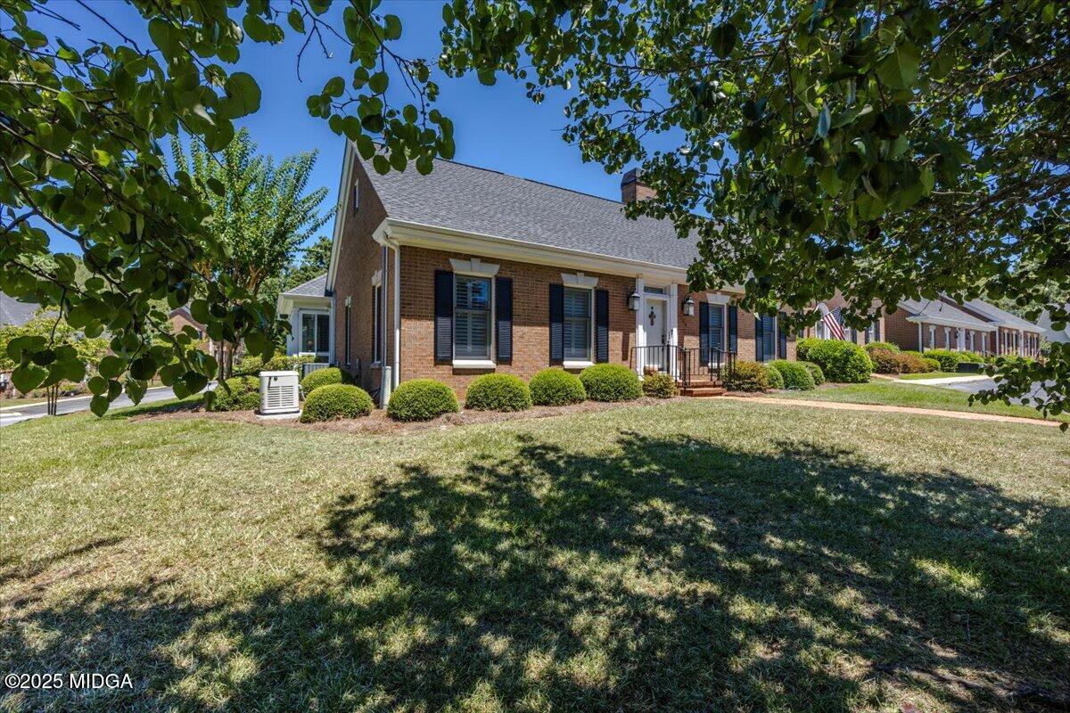 133 Covington Place Macon, GA 31210 - Photo 3 of 36 a front view of a house with garden