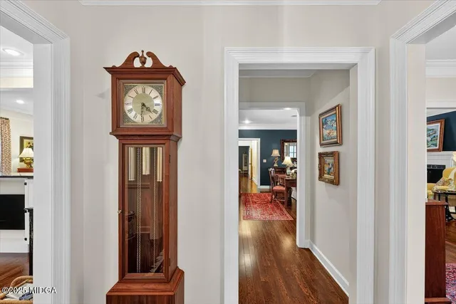 a view of hallway with wooden floor