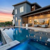 a view of swimming pool with outdoor seating