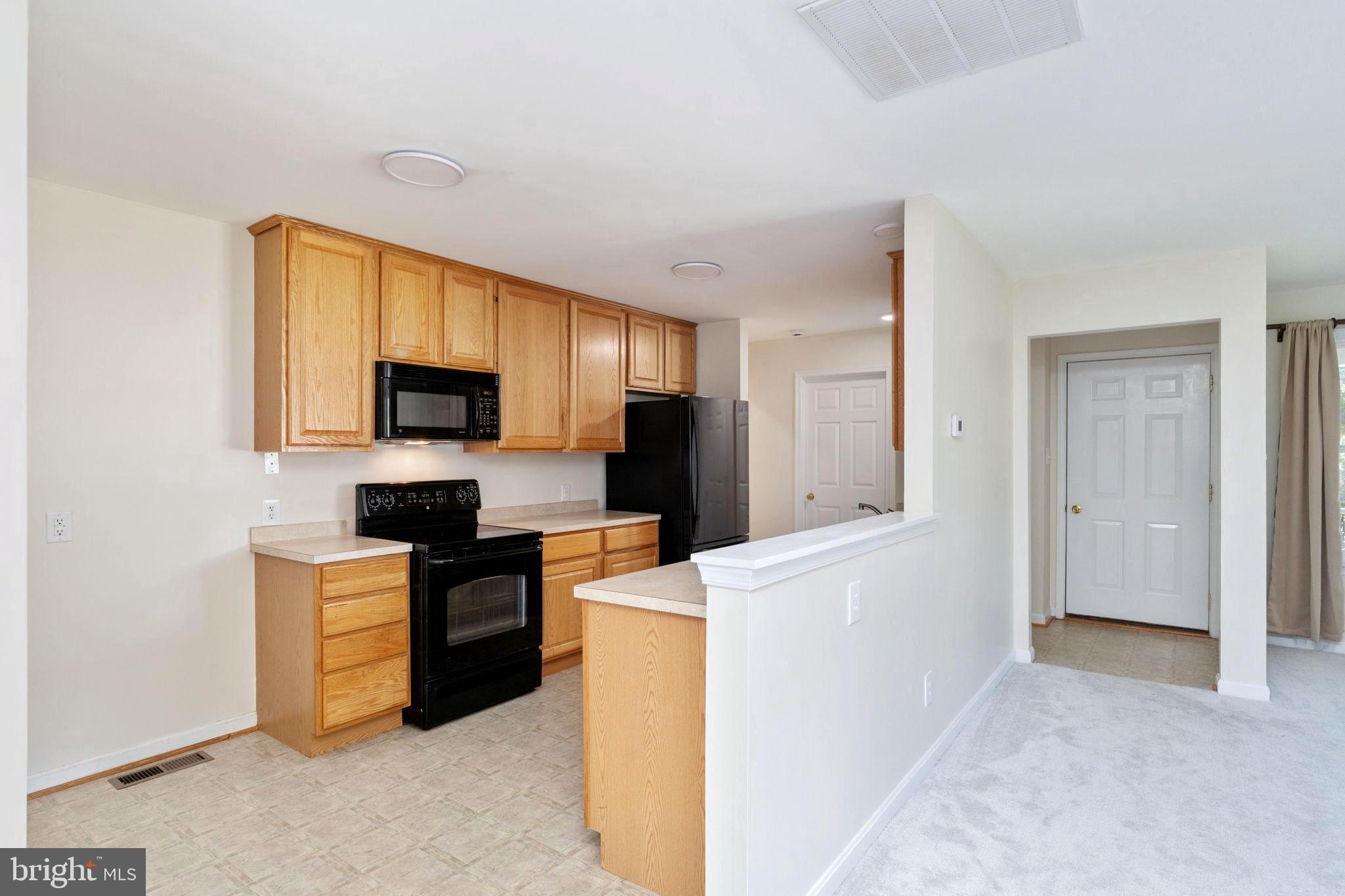 238 12th Street Colonial Beach, VA 22443 - Photo 10 of 32 Open Kitchen and Living Area