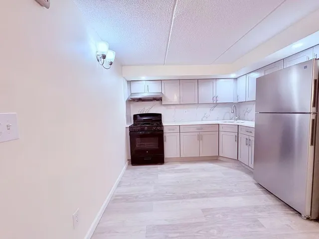 a kitchen with a cabinets and a stove