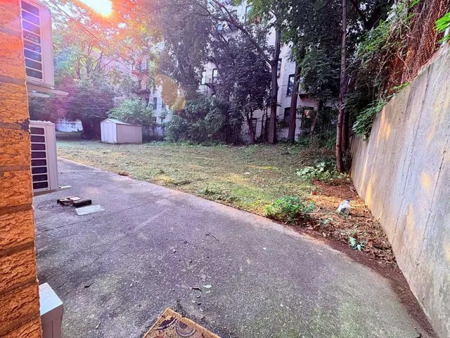 a backyard of a house with lots of green space
