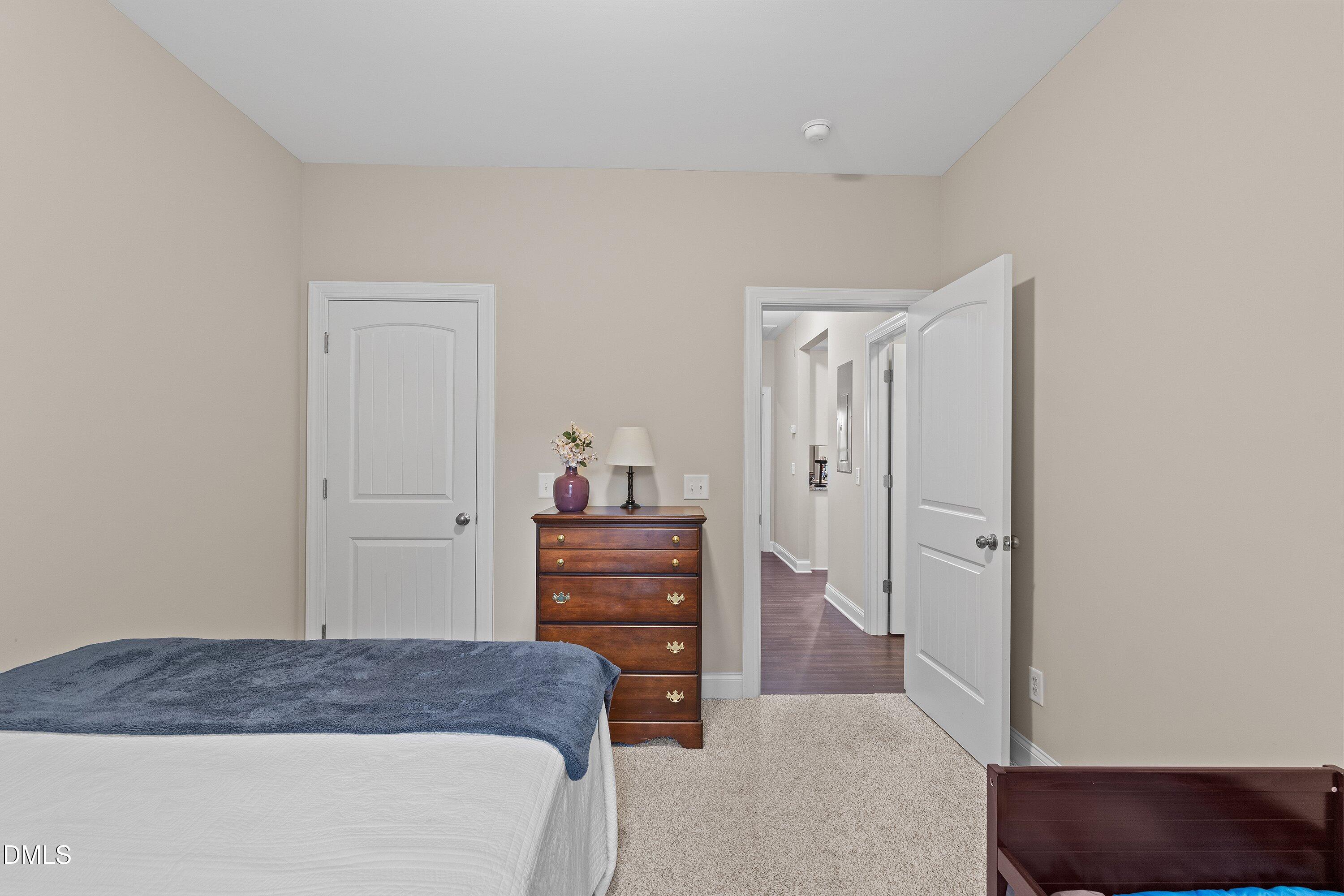 665 Mann Road Coats, NC 27521 - Photo 29 of 53 a bedroom with a bed and furniture