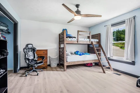 a bedroom with bed and a window