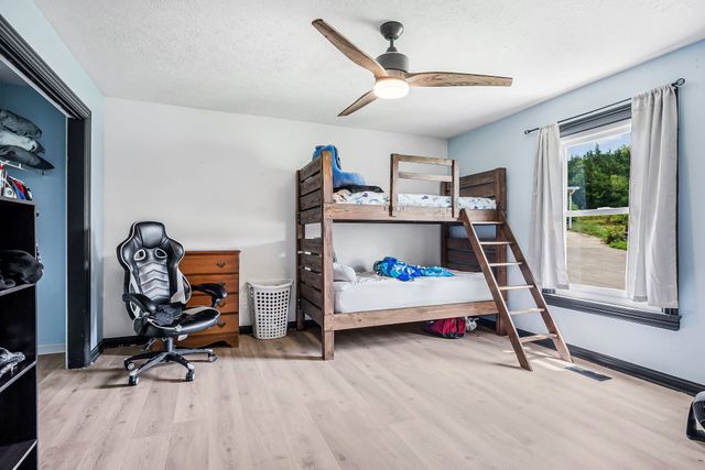 a bedroom with bed and a window