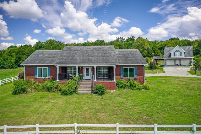 a view of a balcony with a yard