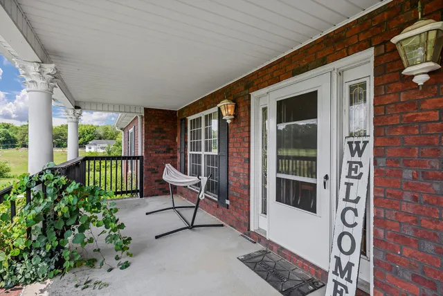 an aerial view of a house with swimming pool garden and patio