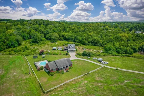 a view of a house with a big yard