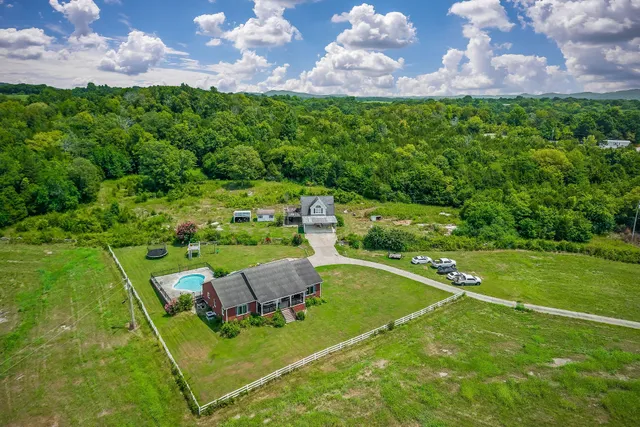 a view of a house with a big yard