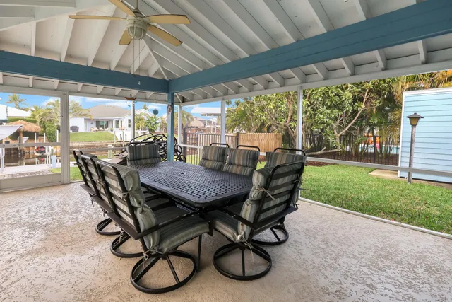 a swimming pool with outdoor seating