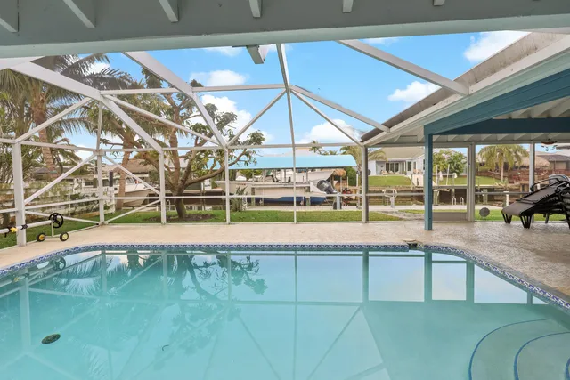a view of a patio with table and chairs
