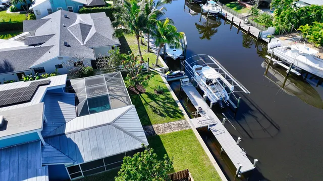 an aerial view of a houses with yard