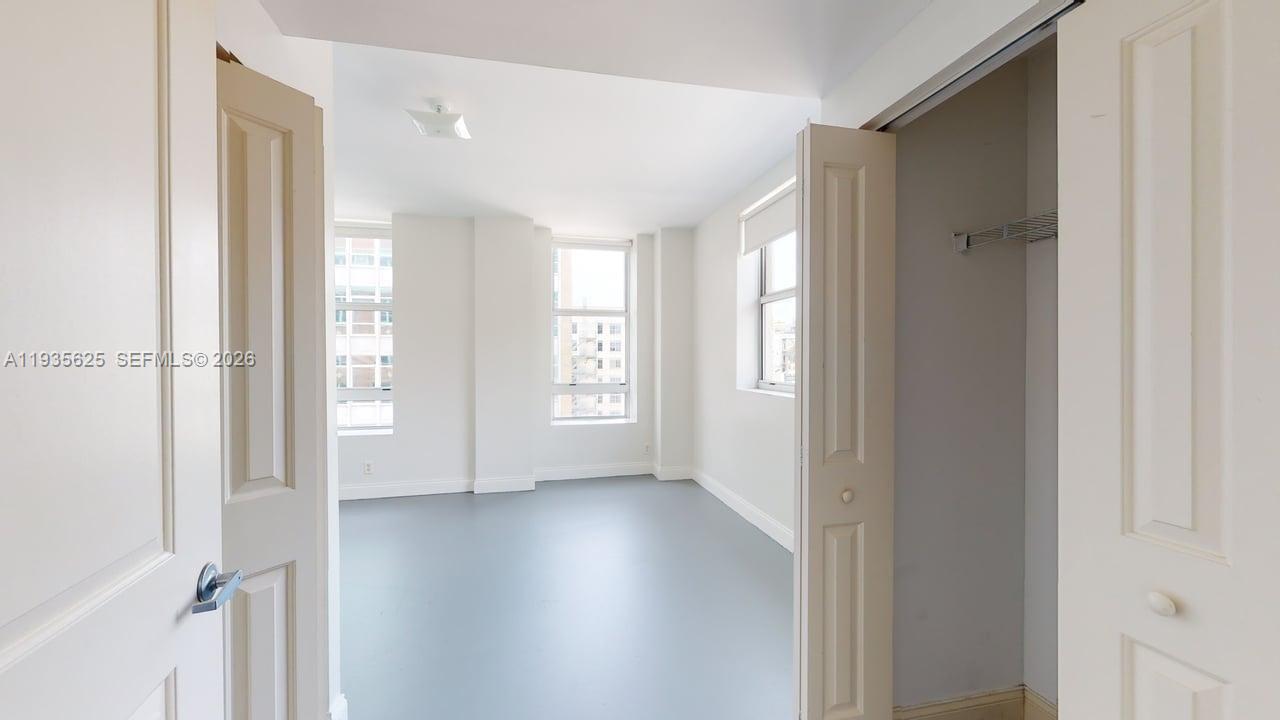 111 East Flagler Street, Unit 810 Miami, FL 33131 - Photo 11 of 19 a view of entryway with wooden floor
