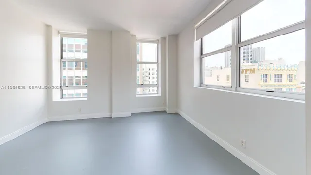 an empty room with a bathroom