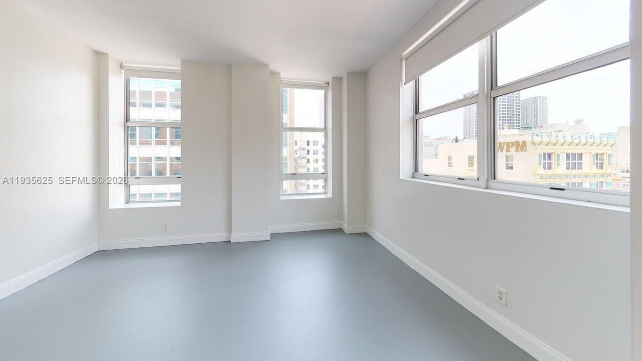111 East Flagler Street, Unit 810 Miami, FL 33131 - Photo 16 of 19 a view of an empty room with a window