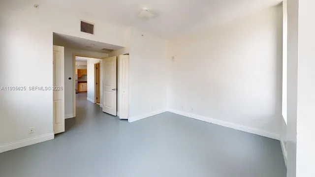a view of hallway with wooden floor