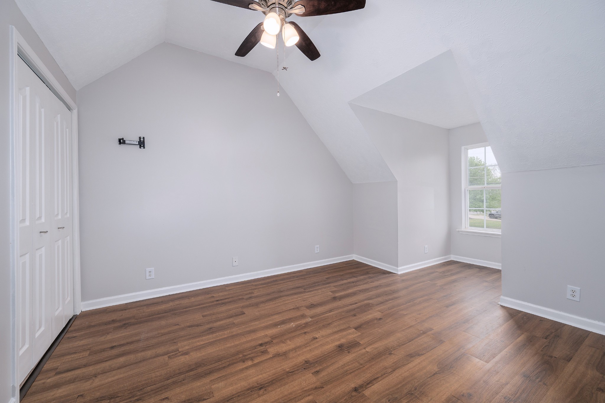 1209 Fall Parkway Murfreesboro, TN 37129 - Photo 12 of 22 a view of an empty room with wooden floor and a window