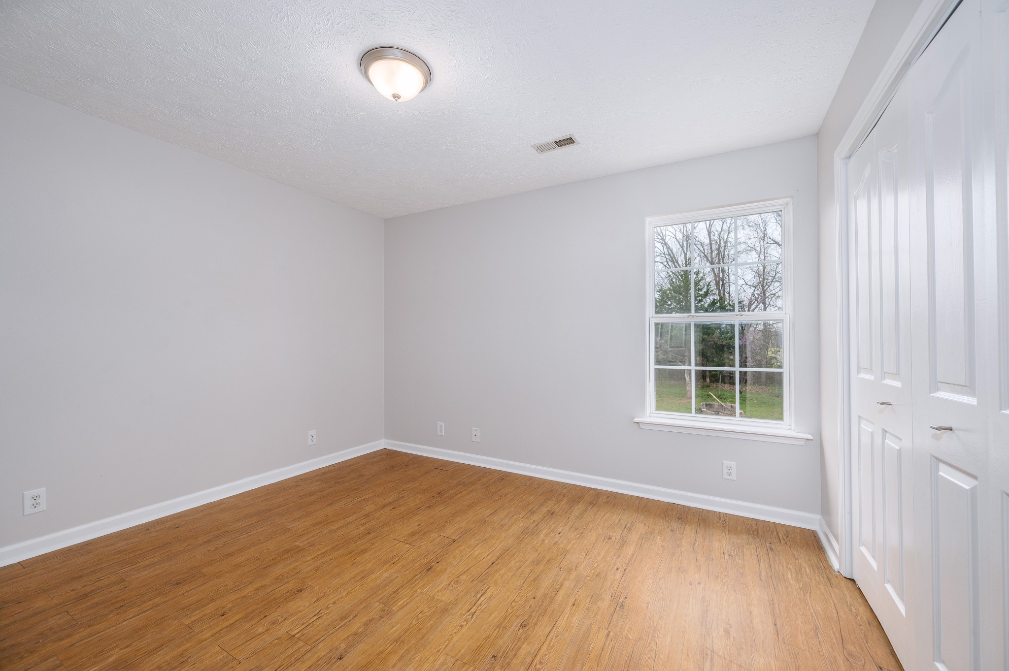 1209 Fall Parkway Murfreesboro, TN 37129 - Photo 14 of 22 an empty room with wooden floor and windows