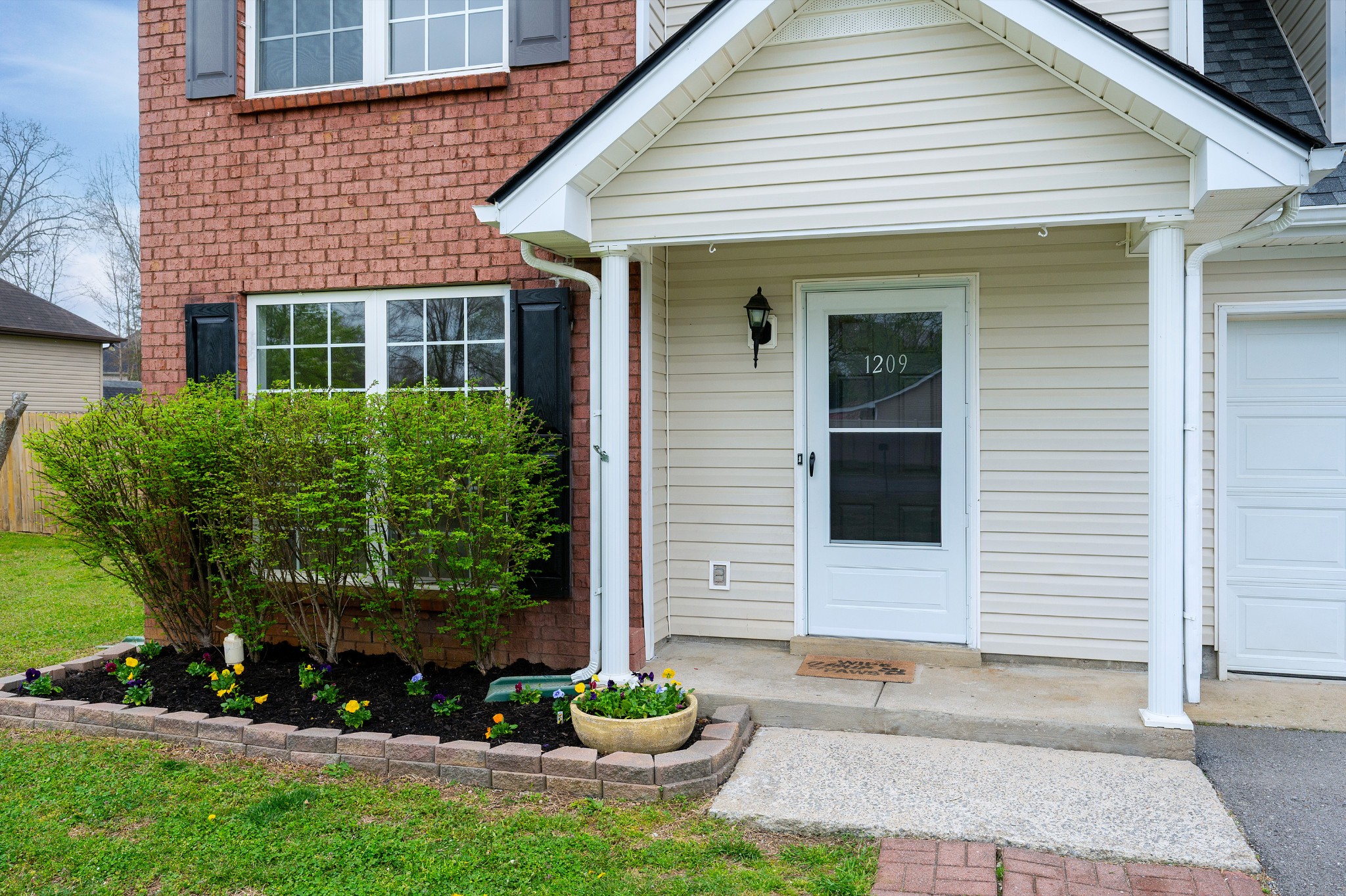 1209 Fall Parkway Murfreesboro, TN 37129 - Photo 19 of 22 a front view of a house with garden