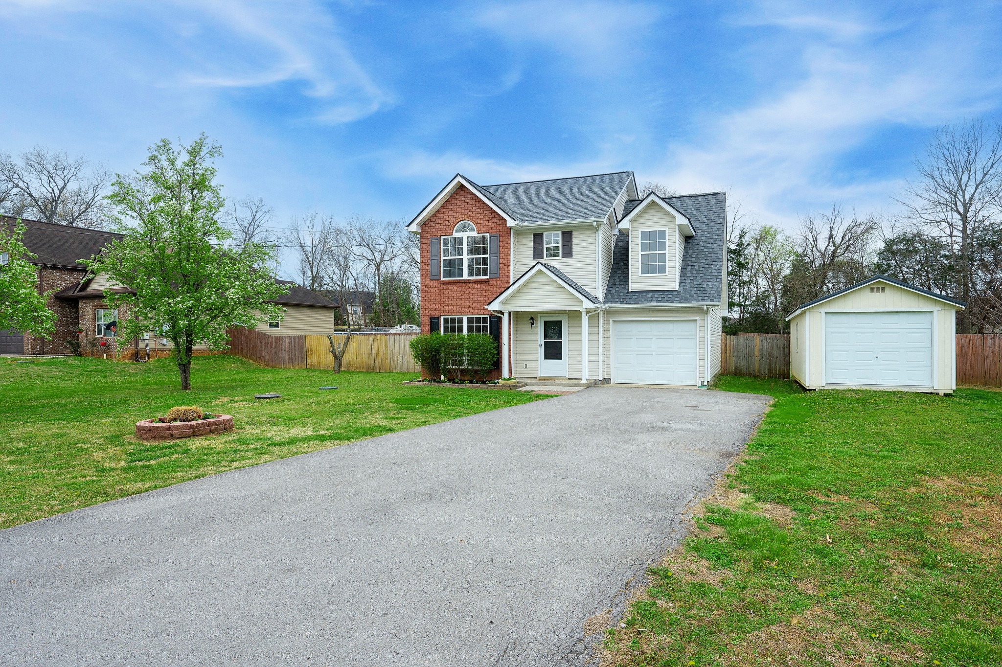 1209 Fall Parkway Murfreesboro, TN 37129 - Photo 21 of 22 a front view of a house with a yard and garage