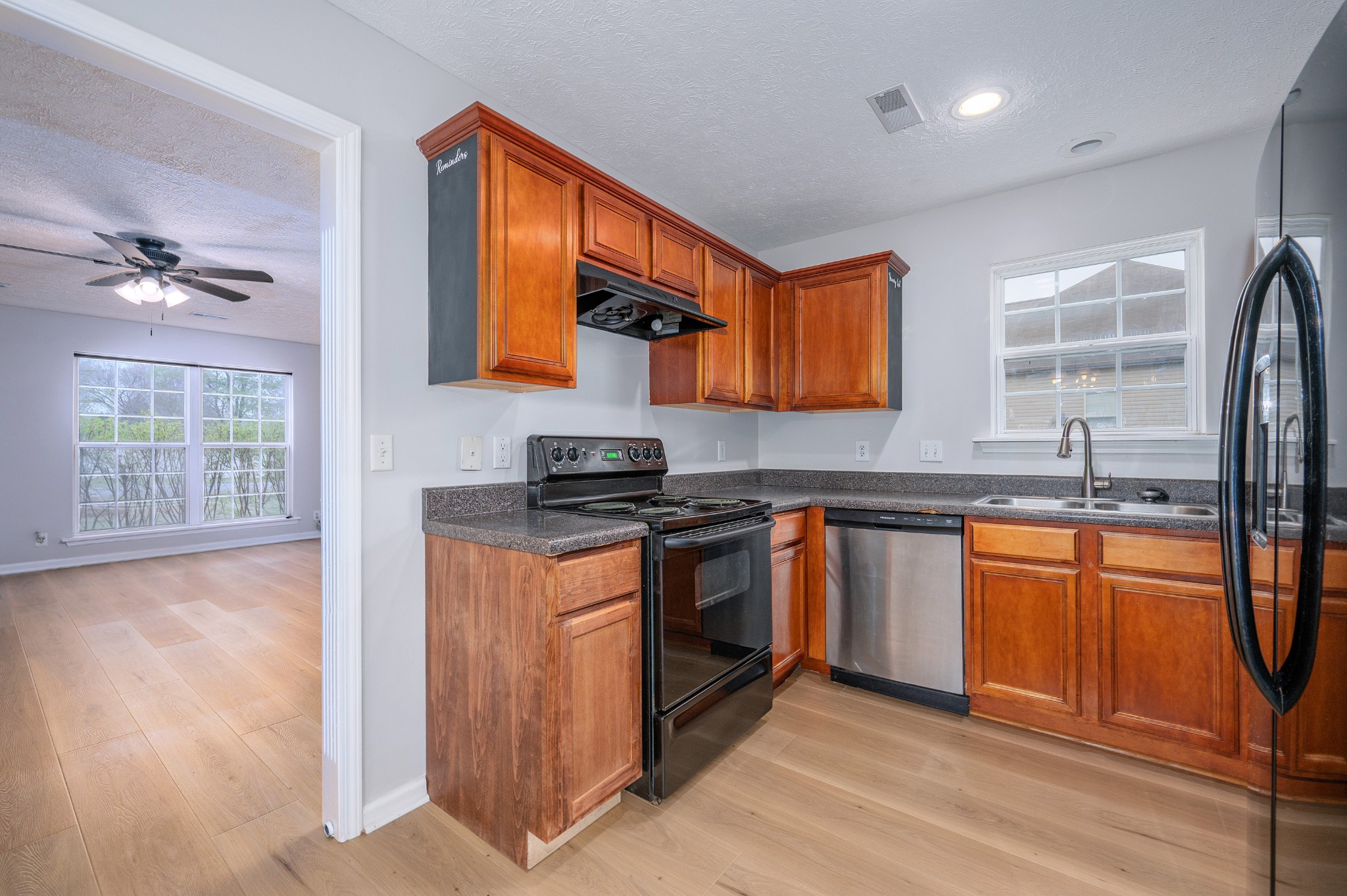 1209 Fall Parkway Murfreesboro, TN 37129 - Photo 5 of 22 a kitchen with stainless steel appliances granite countertop a stove a sink and a refrigerator