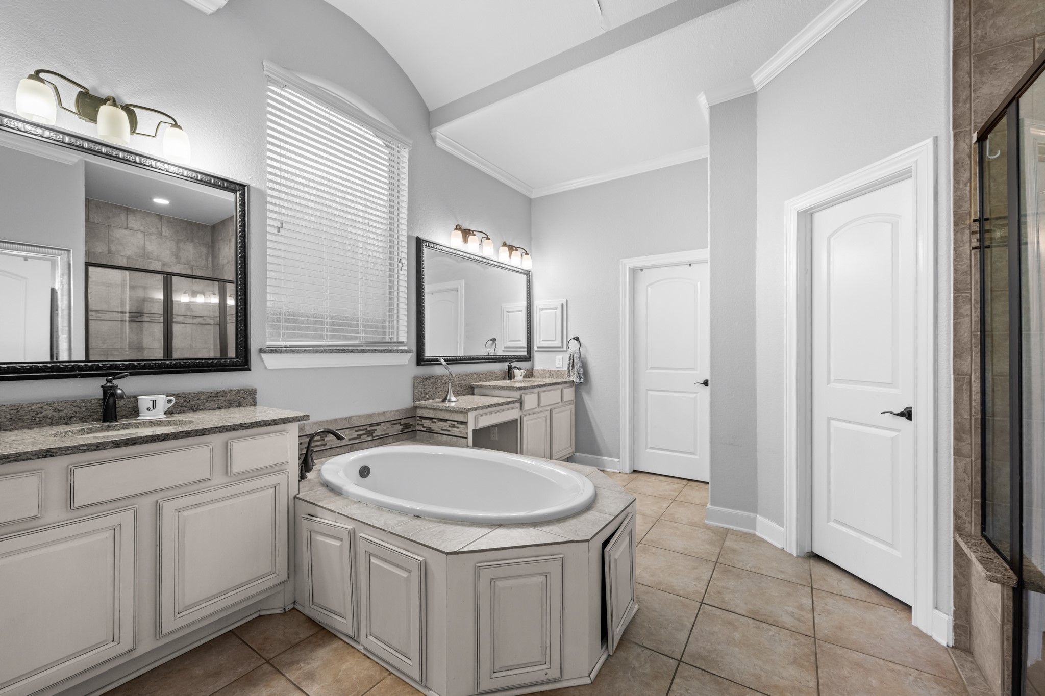 27 Fury Ranch Place Tomball, TX 77375 - Photo 15 of 47 a bathroom with a sink a toilet and mirror