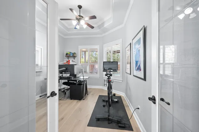 a very nice looking room with a large window and chandelier