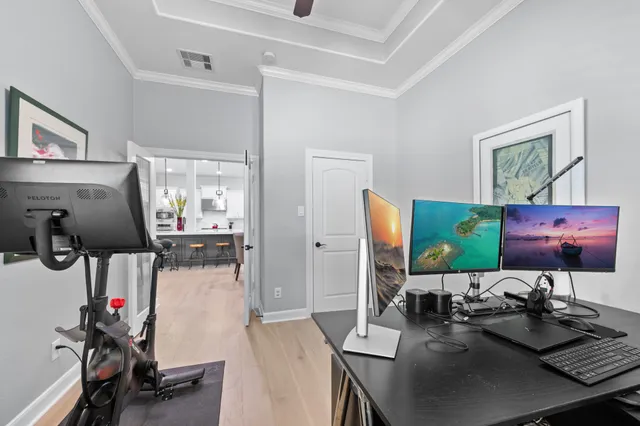 a room with furniture and flat screen tv