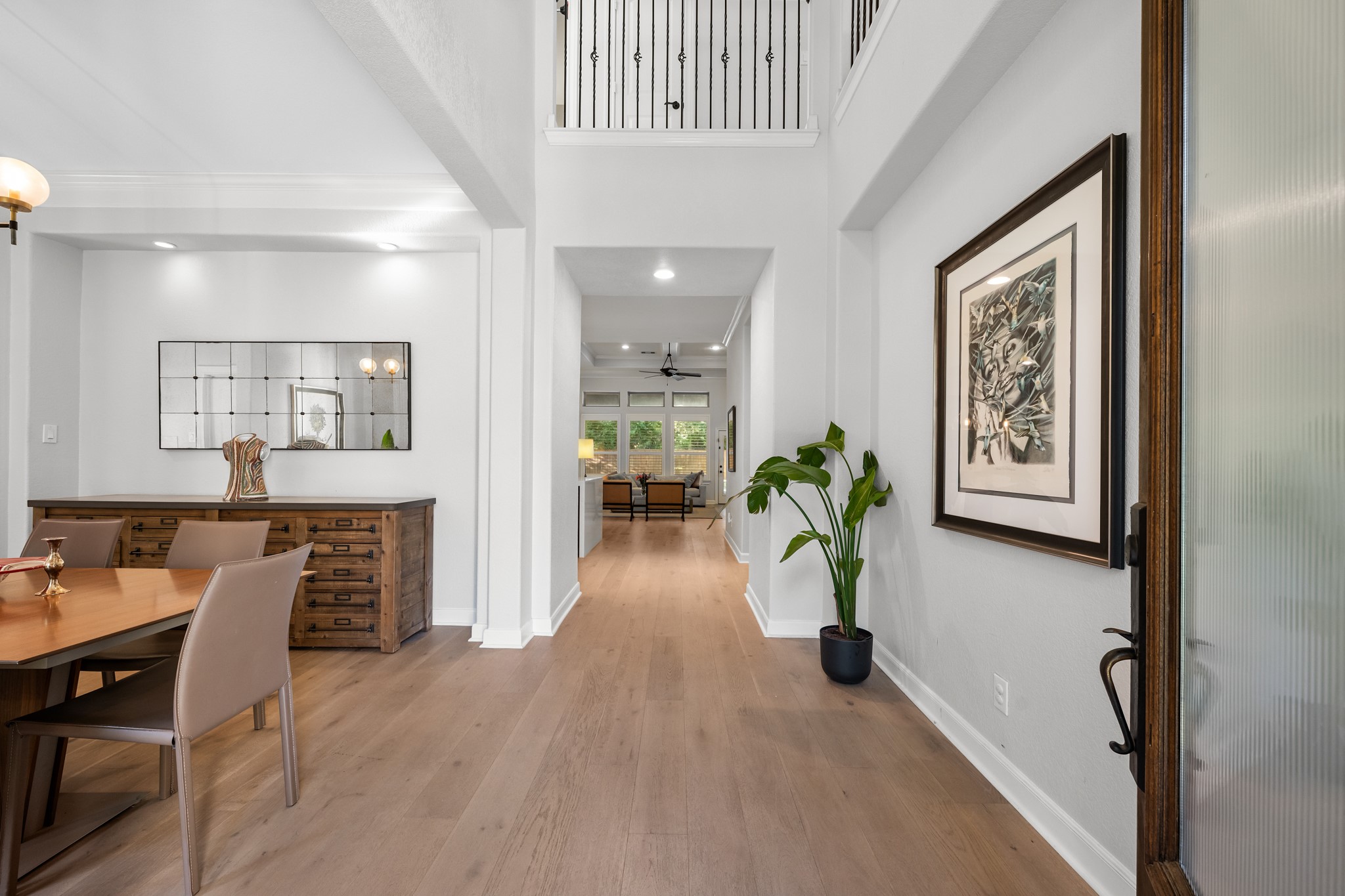 27 Fury Ranch Place Tomball, TX 77375 - Photo 3 of 47 a hallway with furniture and a potted plant