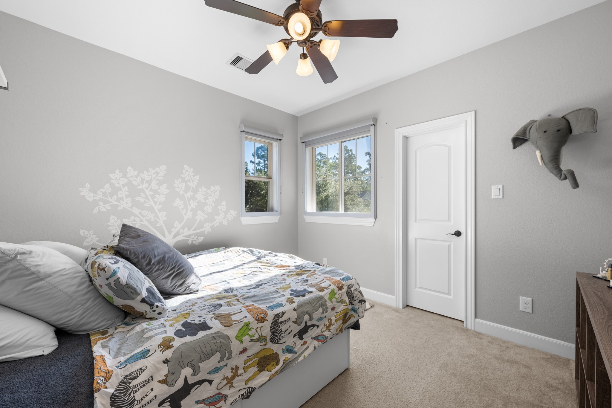 27 Fury Ranch Place Tomball, TX 77375 - Photo 31 of 47 a bedroom with a bed and a chandelier