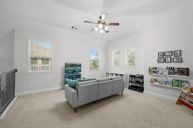 a living room with furniture and a window