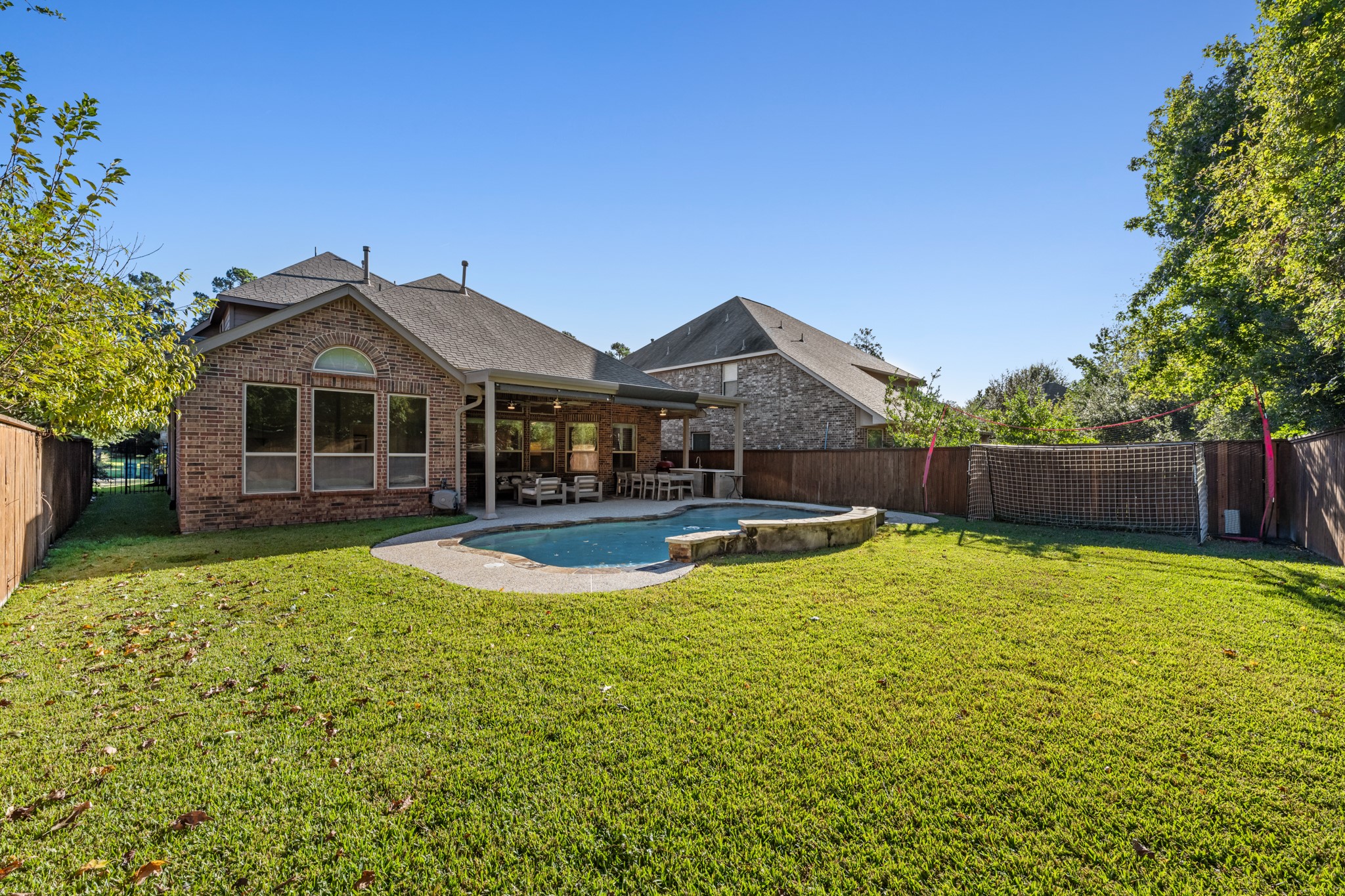 27 Fury Ranch Place Tomball, TX 77375 - Photo 34 of 47 a view of a house with swimming pool and a yard