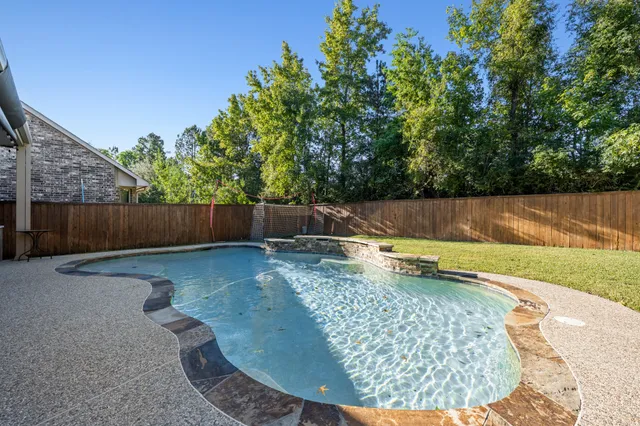 swimming pool view with a outdoor seating