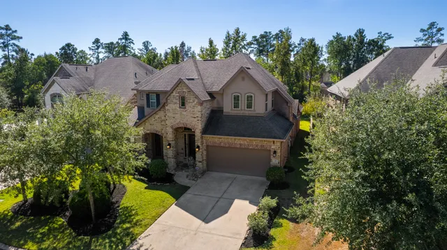 an aerial view of multiple houses with outdoor space