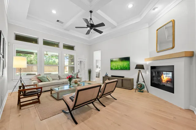 a living room with furniture a window and a fireplace