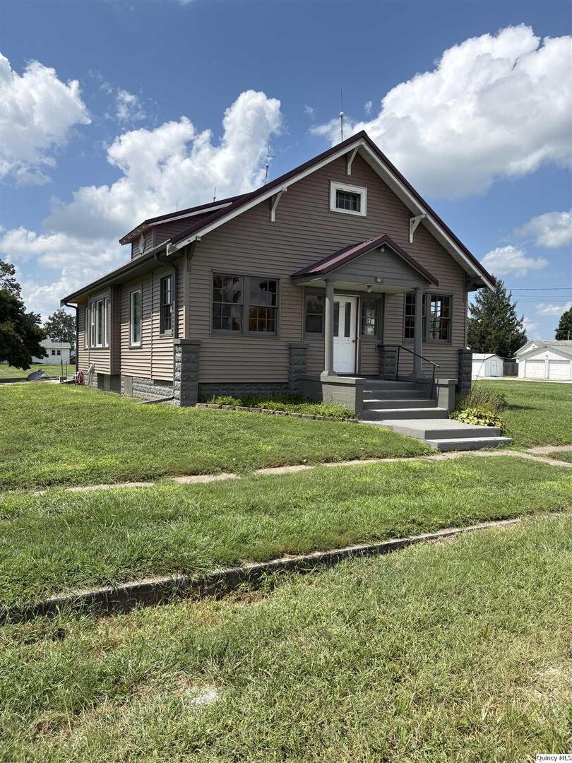 101 North Main Timewell, IL 62375 - Photo 1 of 17 a front view of a house with a yard