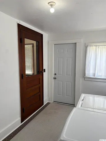 a room with a bed and a window