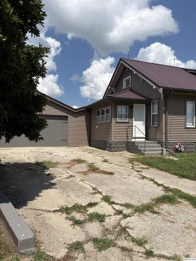 101 North Main Timewell, IL 62375 - Photo 16 of 17 a front view of a house with a yard
