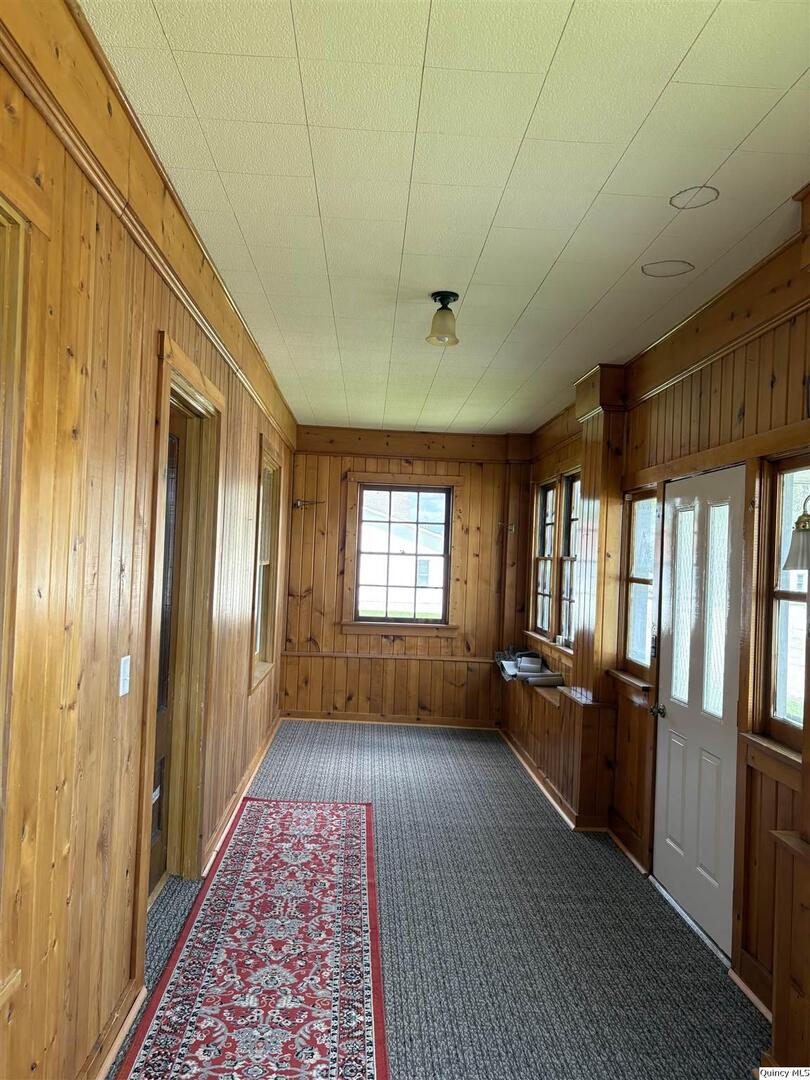 101 North Main Timewell, IL 62375 - Photo 7 of 17 a view of a hallway with wooden floor and furniture