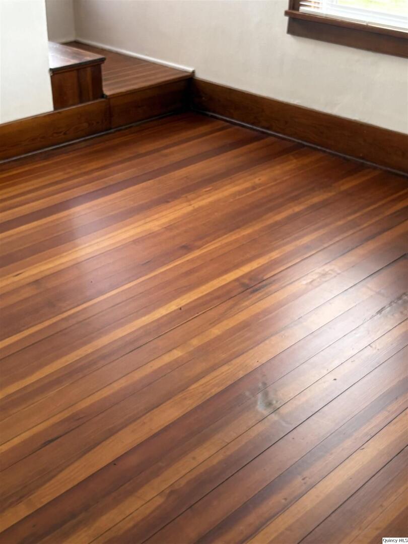 101 North Main Timewell, IL 62375 - Photo 10 of 17 a view of room with wooden floor and chair