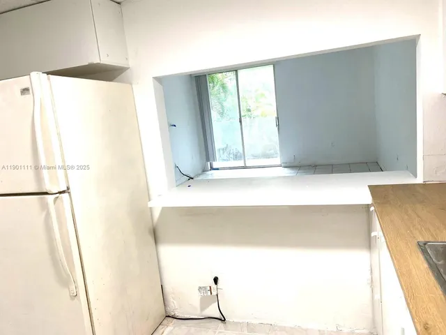 a bathroom with a tub and a shower