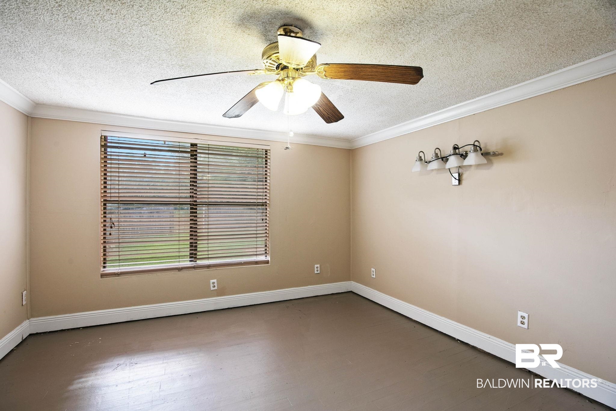 23240 County Road 47 Perdido, AL 36562 - Photo 13 of 29 Unfurnished room featuring ornamental molding, a textured ceiling, wood finished floors, and a ceiling fan