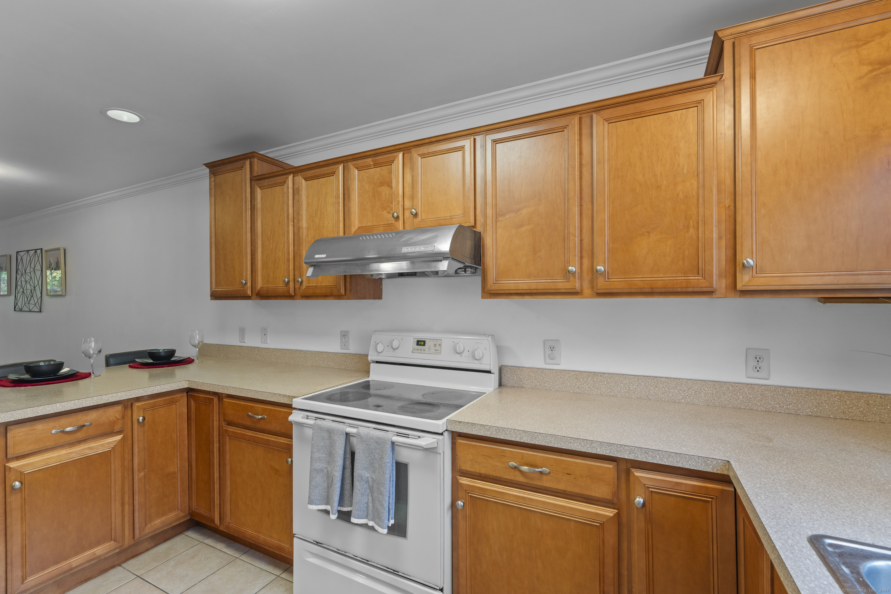 527 West Thames Street, Unit 9 Norwich, CT 06360 - Photo 12 of 25 a kitchen with stainless steel appliances granite countertop a sink a stove and a refrigerator