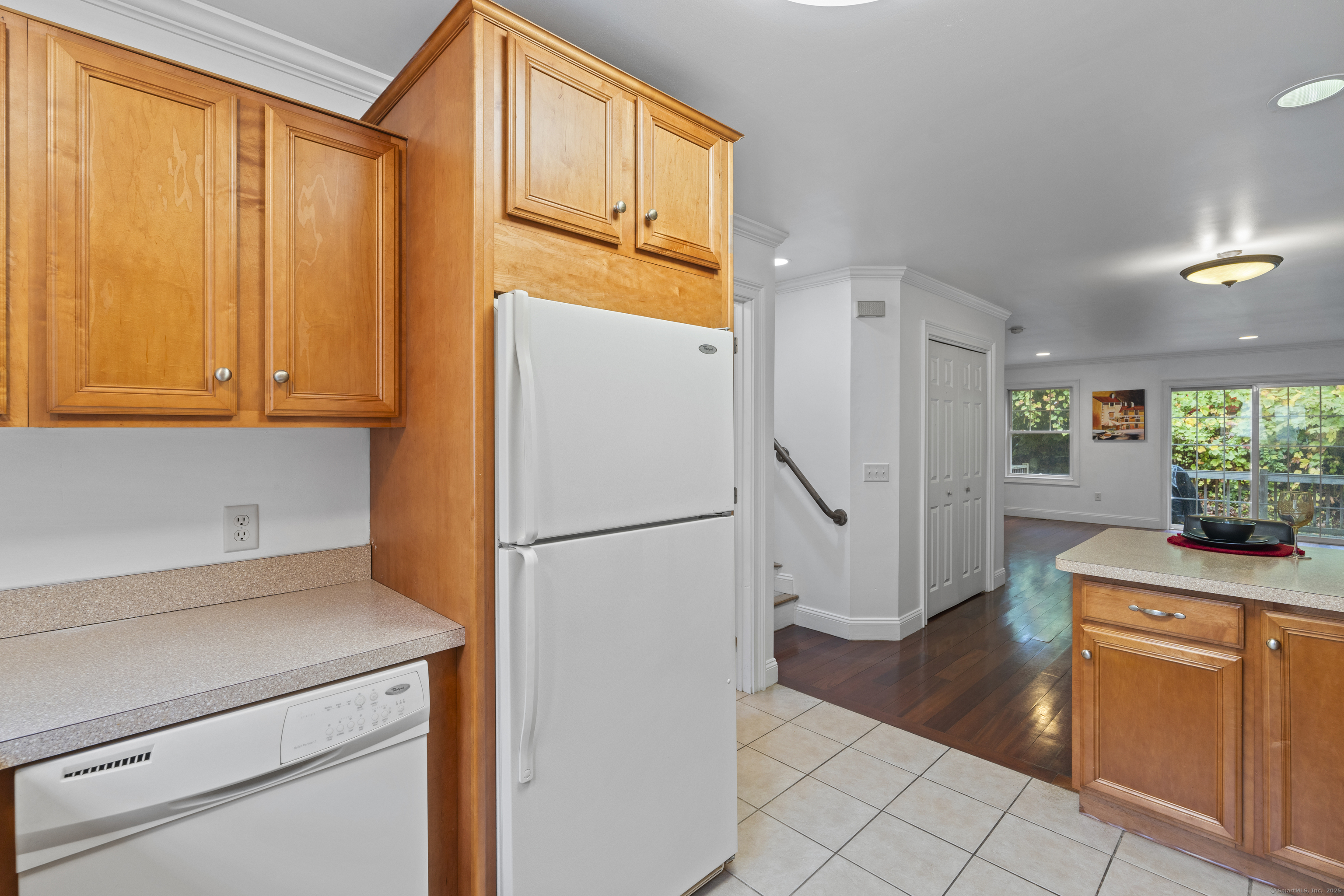 527 West Thames Street, Unit 9 Norwich, CT 06360 - Photo 13 of 25 a kitchen with a refrigerator a stove a washer and dryer