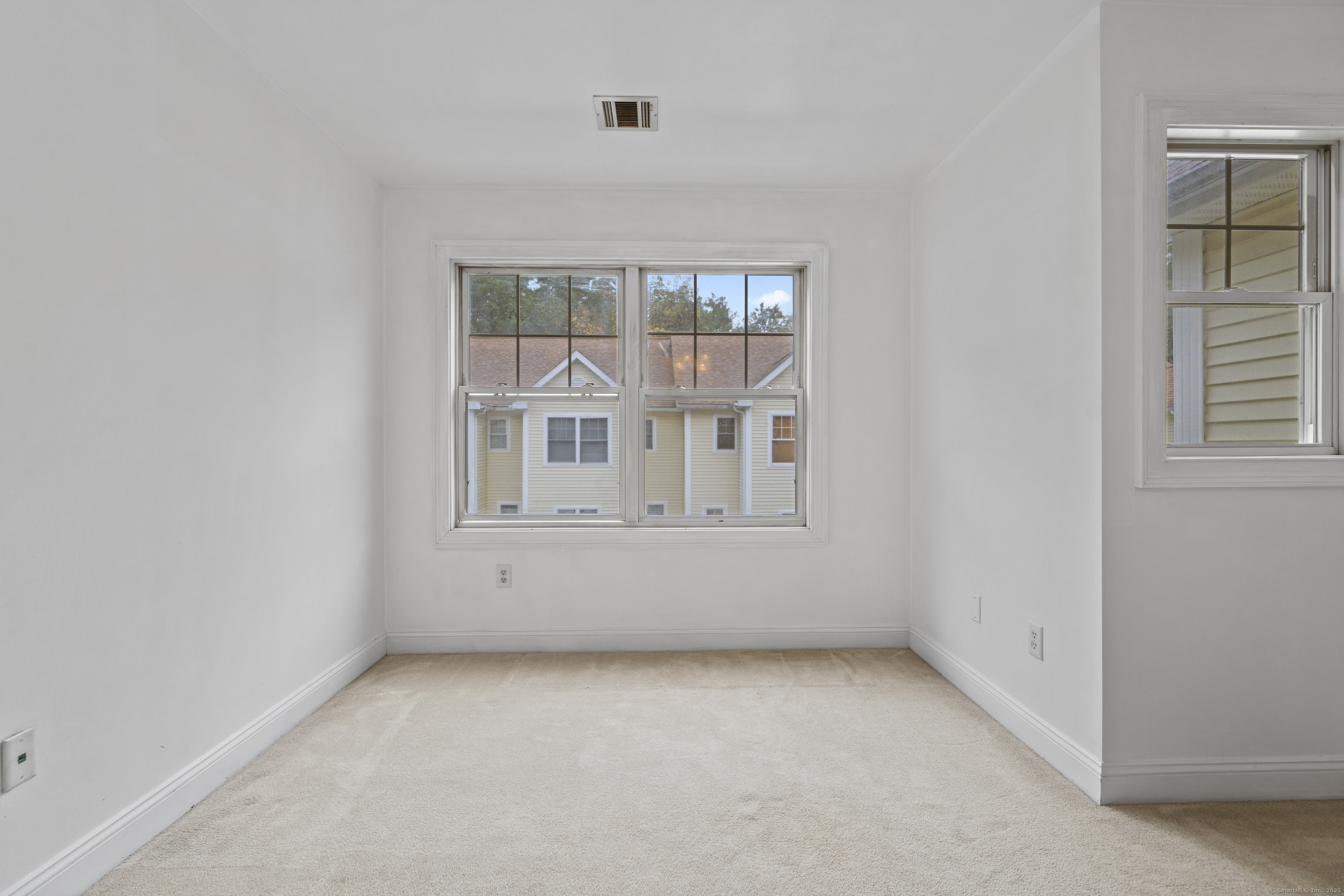 527 West Thames Street, Unit 9 Norwich, CT 06360 - Photo 14 of 25 an empty room with windows