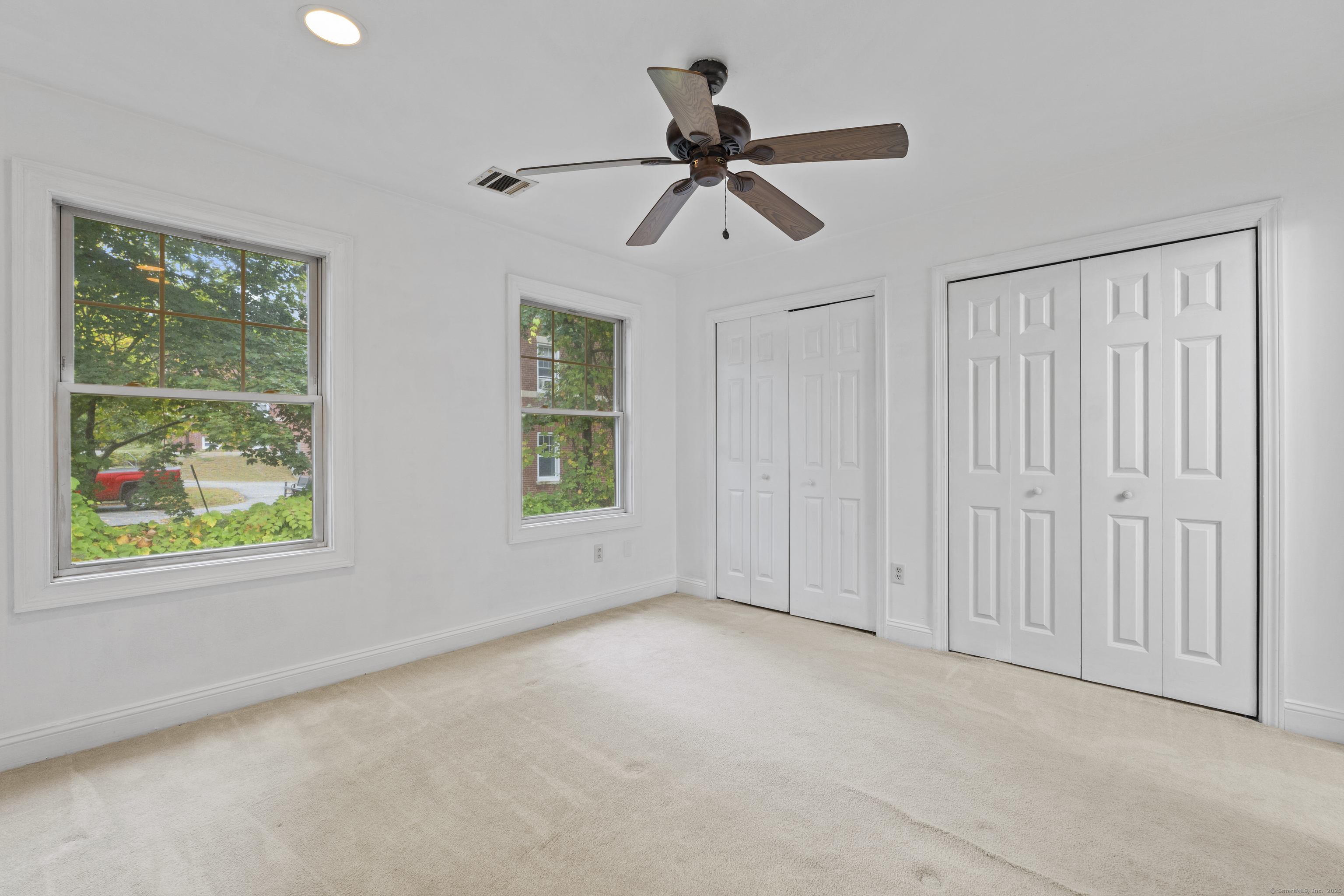 527 West Thames Street, Unit 9 Norwich, CT 06360 - Photo 17 of 25 an empty room with windows and closet